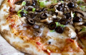 Pizza with mushrooms, peppers and olives