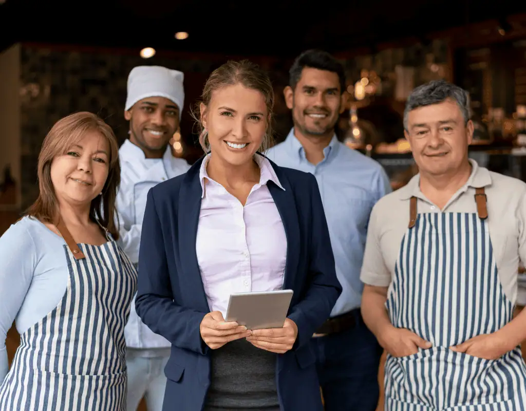 Smiling restaurant owner in Southwest Florida confident after cutting POS fees.