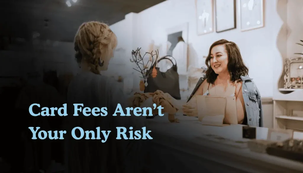 Small business owner at checkout helping customer with card payment highlighting risks beyond credit card processing fees