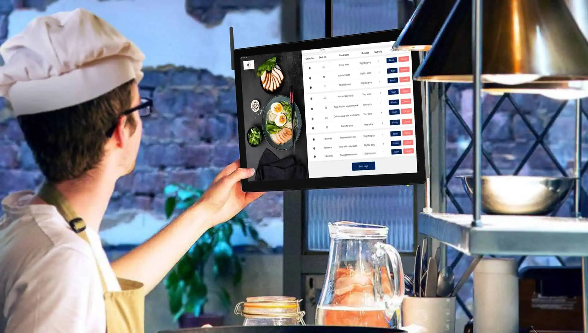 Chef using a digital kitchen display system (KDS) to manage restaurant orders and improve kitchen communication.